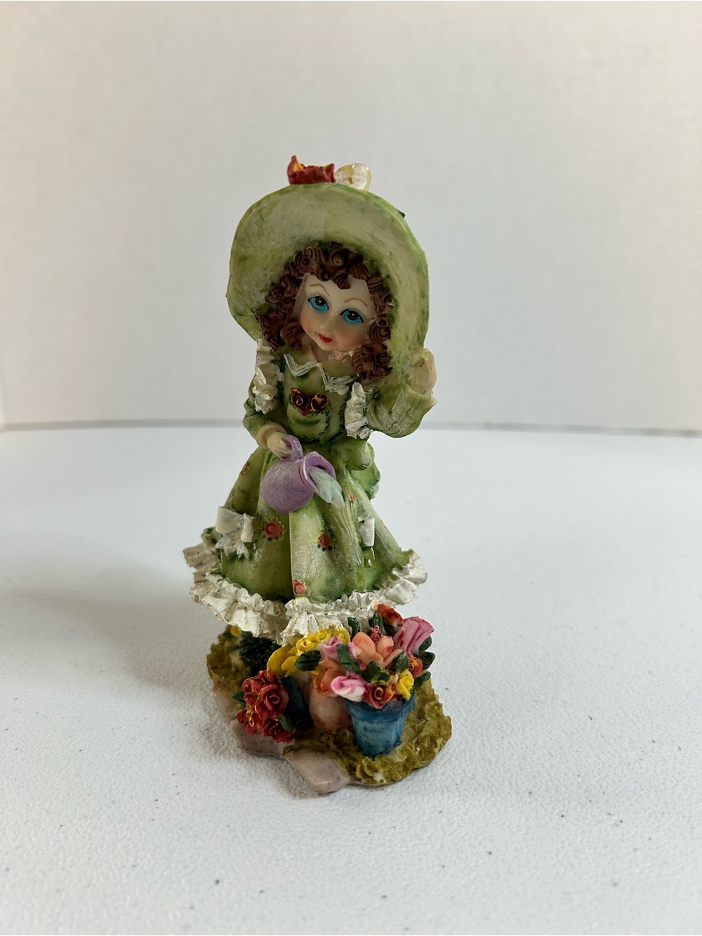 Green Floral Girl Figurine with Purple Watering Can